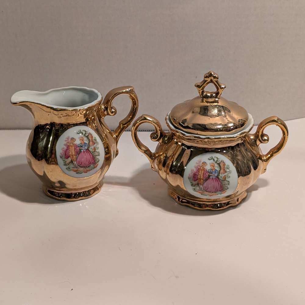 A Vintage vintage Empress by Haruta porcelain creamer and sugar bowl set. 